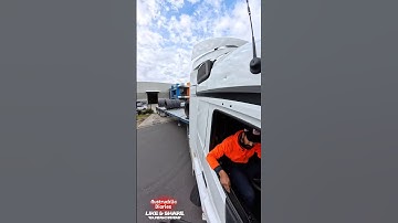 Reversing Semi Flatbed Trailer With Steel Coils On Top. Heavy Load. Trucking Australia.