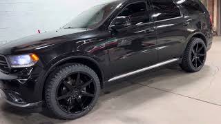 DODGE DURANGO 22” GLOSS BLACK 7 SPOKE WHEELS ON ALL TERRAIN TIRES