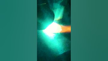 Manually welding head and port onto custom hydraulic cylinder barrel.