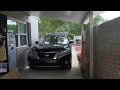 Carport crammed by concrete wall Carport crammed by concrete wall