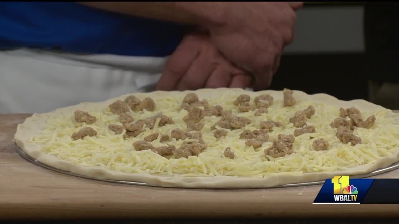 Grotto Pizza makes swirl of fire pizza