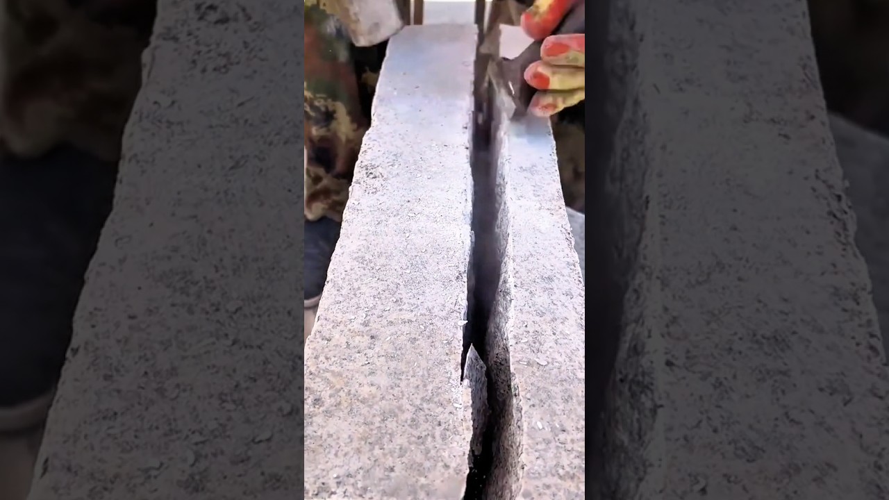 Splitting Solid Concrete Blocks Carefully Guiding the Chisel Precisely to Create Clean Straight Cuts
