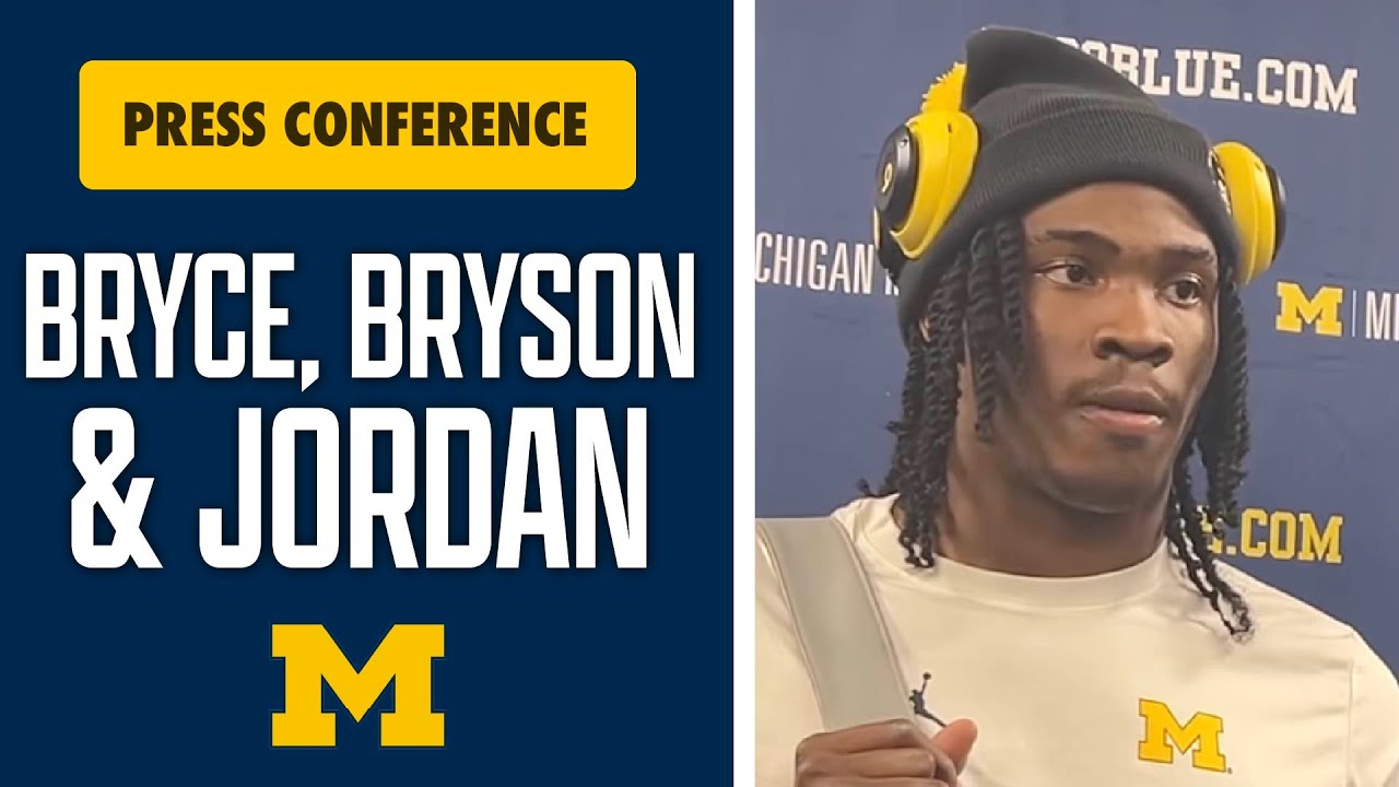 Брайс Андервуд, Брайсон Кузджал, Джордан Янг после победы Мичиганского футбольного клуба над Севе...