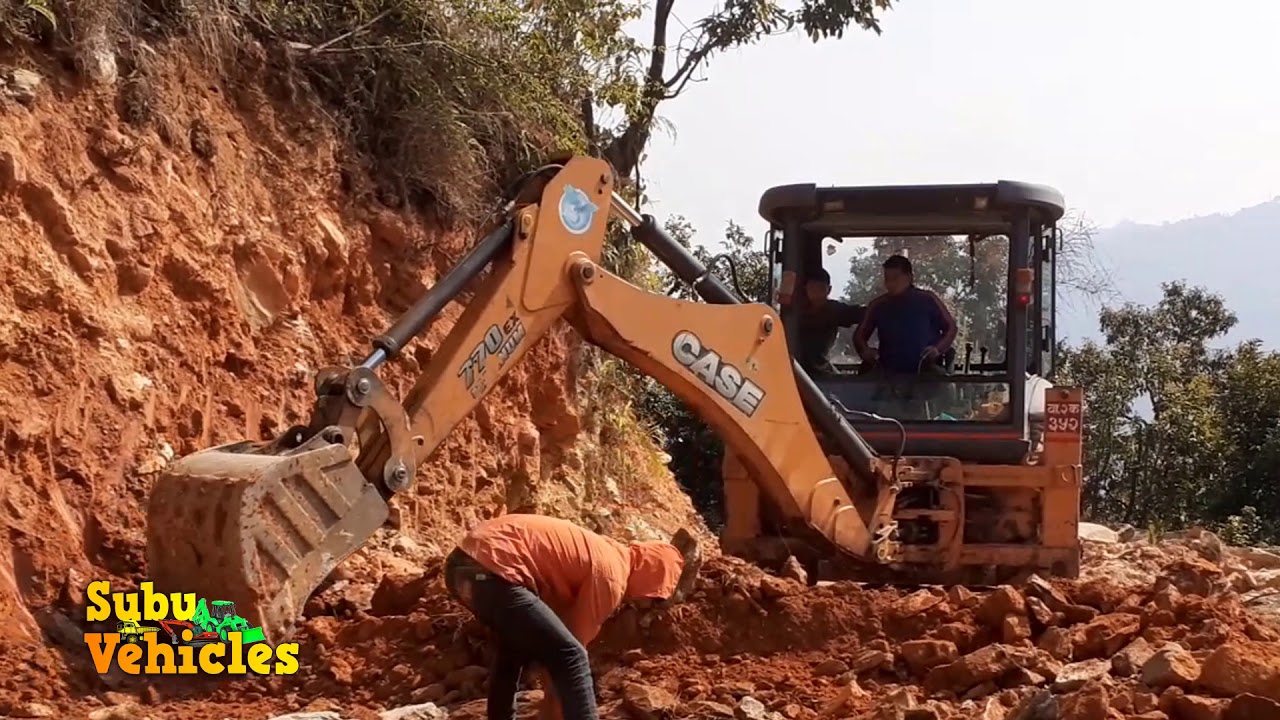 jcb case 770 EX digging in road makeing new road for villagers