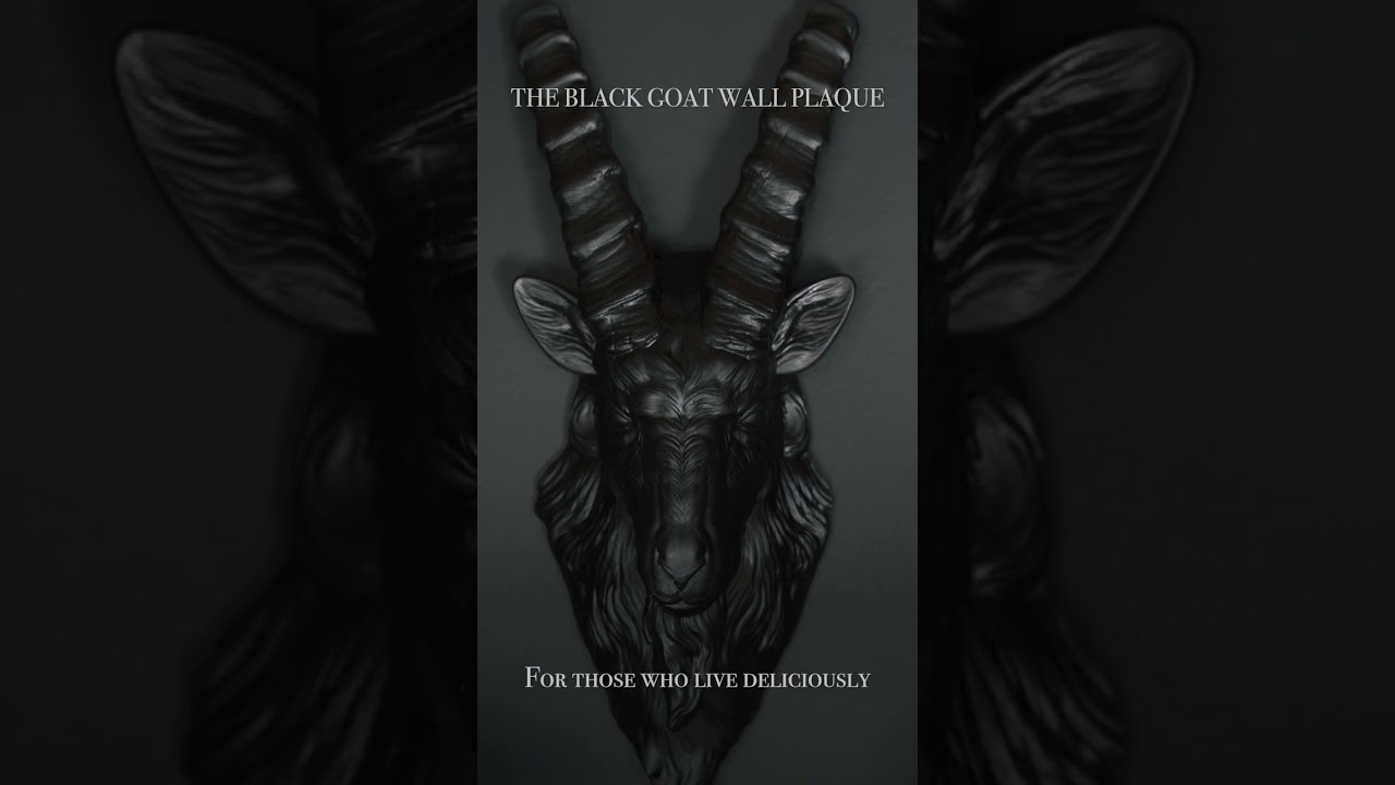 Summon dark elegance to your walls with this striking black goat relic