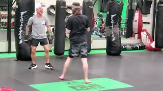 Ryan doing some muay thai pad training.