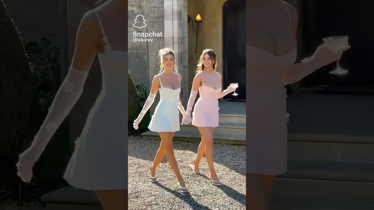 Attractive twins walking side-by-side 