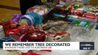 Community members decorate 'We Remember Tree' to honor those lost to substance use
