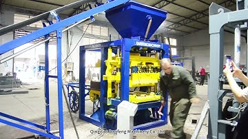 QT4-26 semi automatic block machine making hollow blocks.