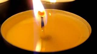 miracle heart appears at the candle flame of Lord Jesus Christ
