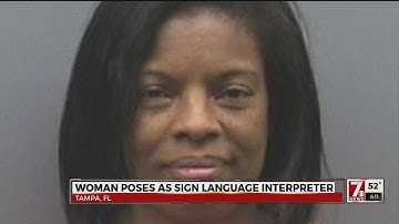 Woman poses as sign language interpreter