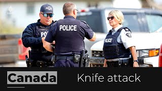 Canada police say 1 stabbing suspect dead, other still at large