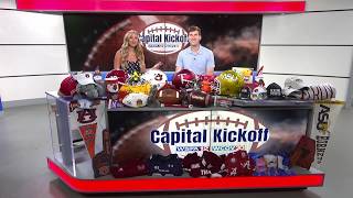 Rosie and Davis show off the Capital Kickoff Shows borrowed swag
