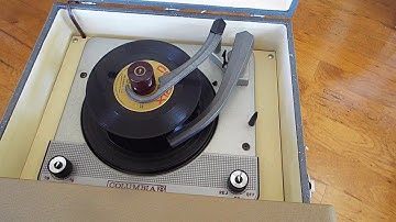 Columbia 4 speed automatic record player playing a stack of 45