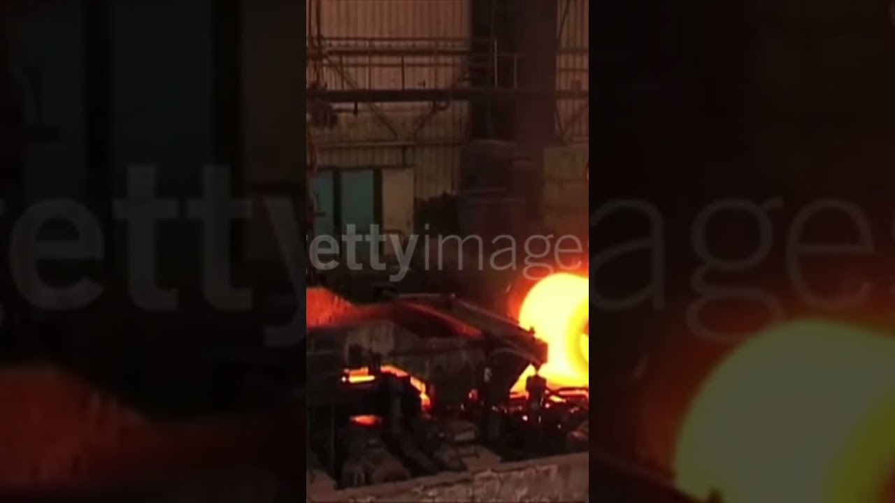 Molten Steel Coil Rolling Process in Action – Industrial Metal Production..  
