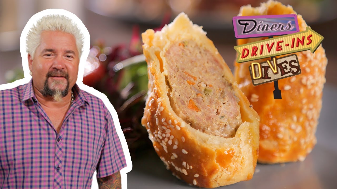 Guy Fieri Eats a Pork and Fennel Sausage Roll | Diners, Drive-Ins and Dives | Food Network