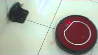 eRobot vacuum cleaning Robots going back for auto recharging_xvid.avi