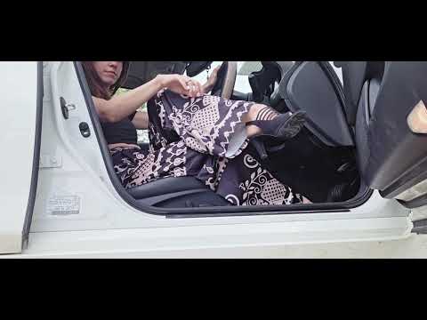 SHOEPLAY IN CAR WITH BLACK OPEN HEELS