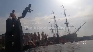 Netherlanders and tourists enjoy dip in Amsterdam during heatwave