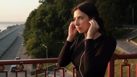 Putting On Earphones Stock Video