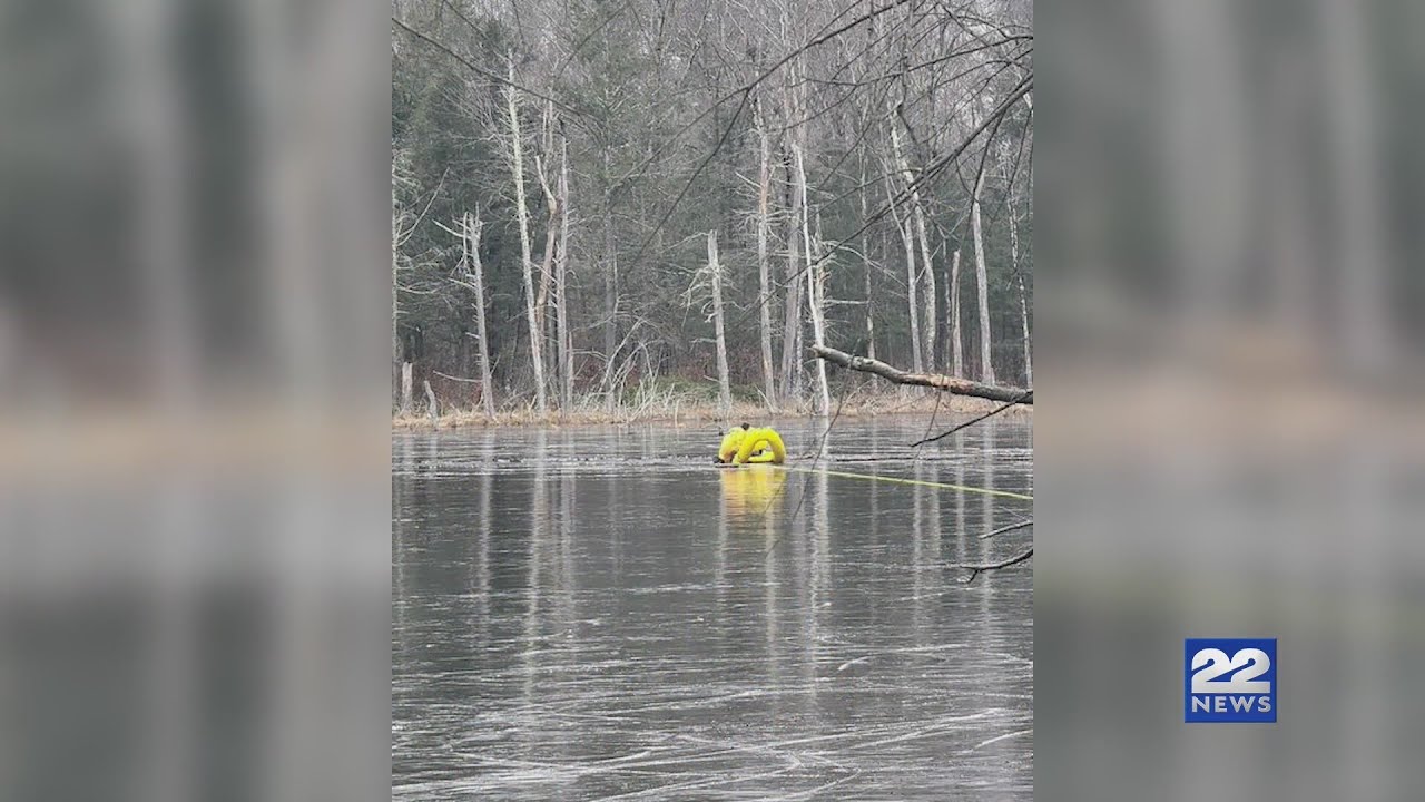 Man rescued from pond after falling through ice - YouTube