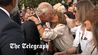 video: Watch: Moment woman kisses King Charles outside Buckingham Palace