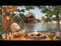 Cozy lake house porch in spring ambience with relaxing lake waves campfire and birdsong