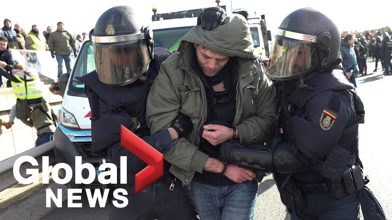 Police clash with striking taxi drivers in Madrid