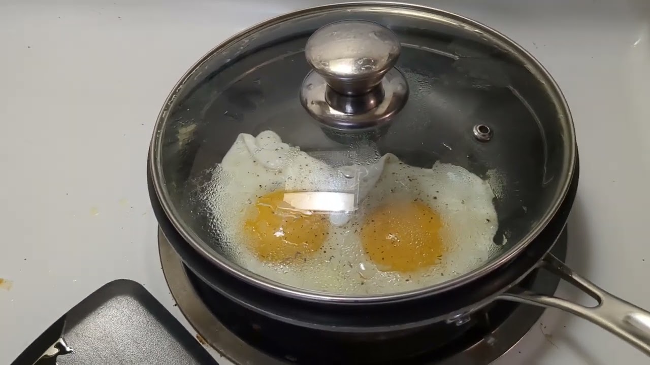 making a breakfast sandwich - fried eggs