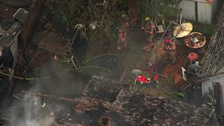 Raw video: Crews work to put out house fire in Southeast Portland