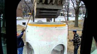 cat345CL unloading the manhole