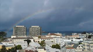 Slow motion time lapse of rainbow appearing over the SF Bay