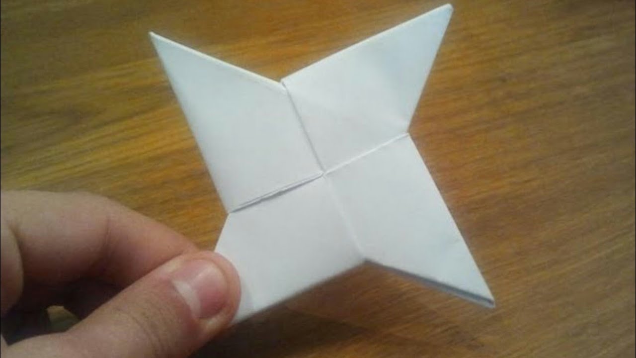 Сделай остры. Сюрикен Бумеранг из бумаги. Оригами Бумеранг сюрикен. Оригами из бумаги Бумеранг звезда. Звездочка Бумеранг из бумаги.