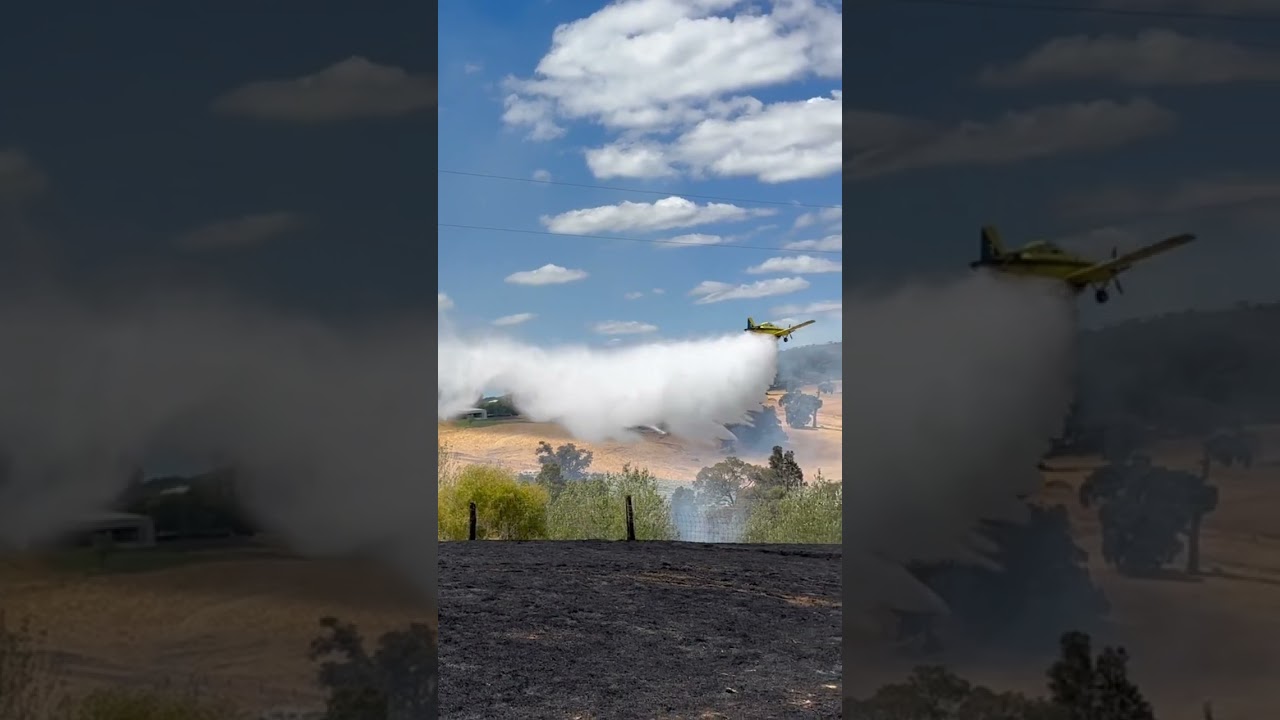 Air Tractor Dropping Water On Fire