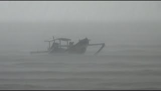 Small Boat on the Sea during Heavy Rain