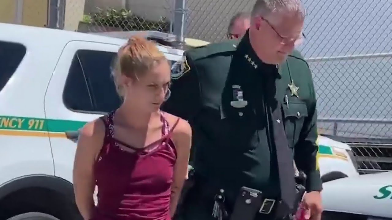 Woman arrested after video shows her putting dog in the trunk - YouTube