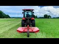 Explaining the RK37 shuttle shift transmission while mowing the hay field
