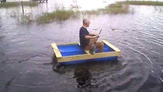 Grampa rows a blue barrell boat