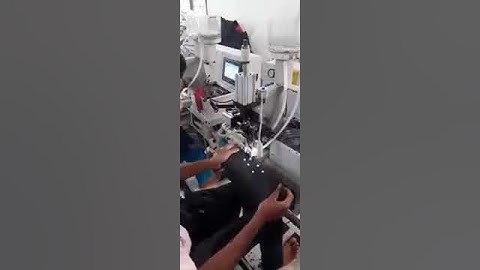 Pearl attach with auto feeder machine in garments industry.