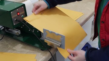 Labeling envelopes with New Path WP20 label applicator