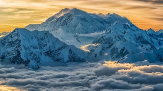 Aerial image of Mount Logan rising above the clouds in Kluane National Park and Reserve, Yukon...