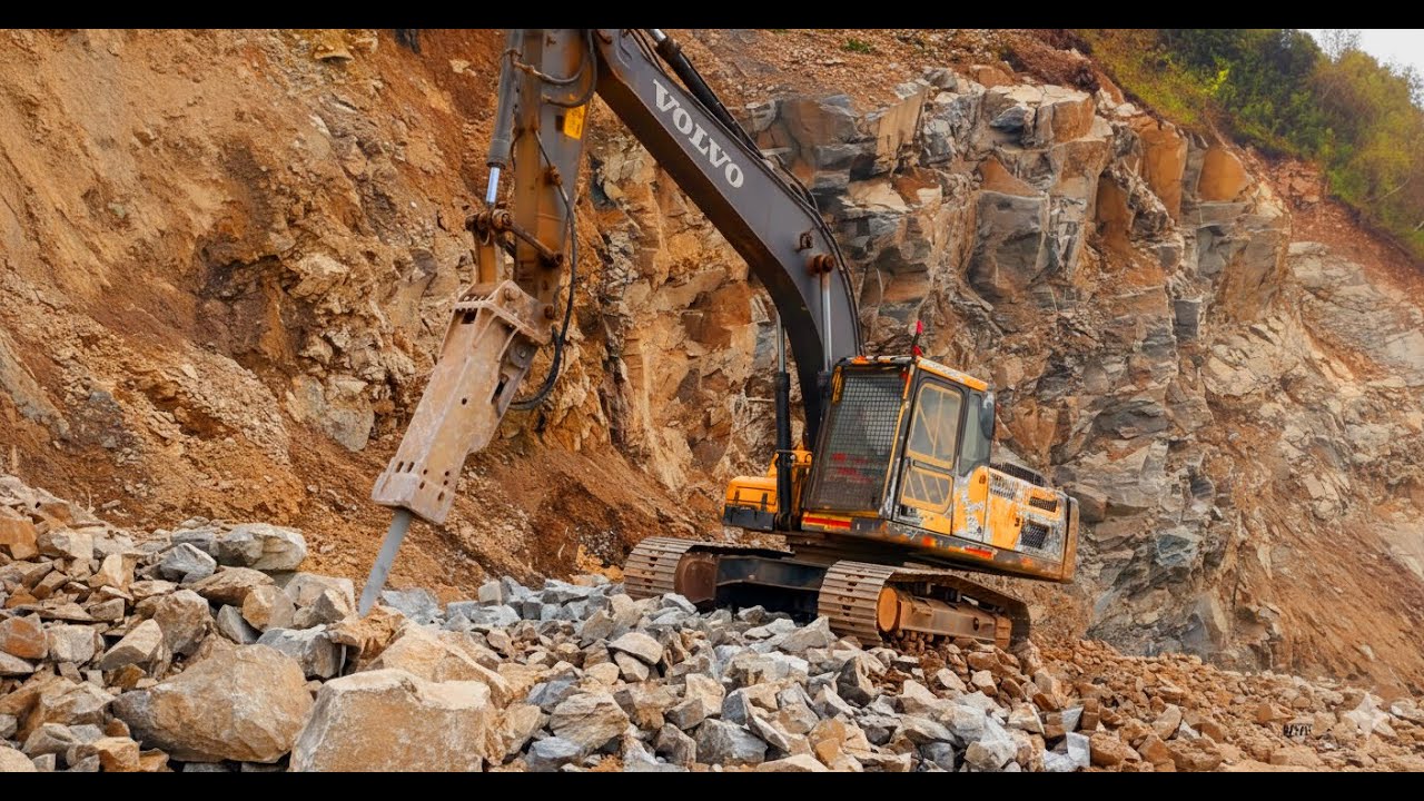 Hydraulic hammer working on top hill - Volvo EC210D 