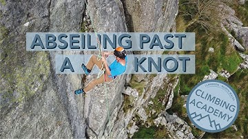 Abseiling past a knot