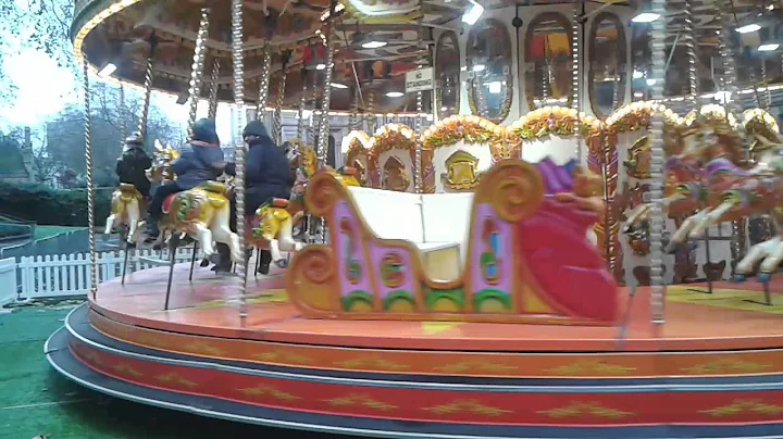 Michael on the merry go round at the museum