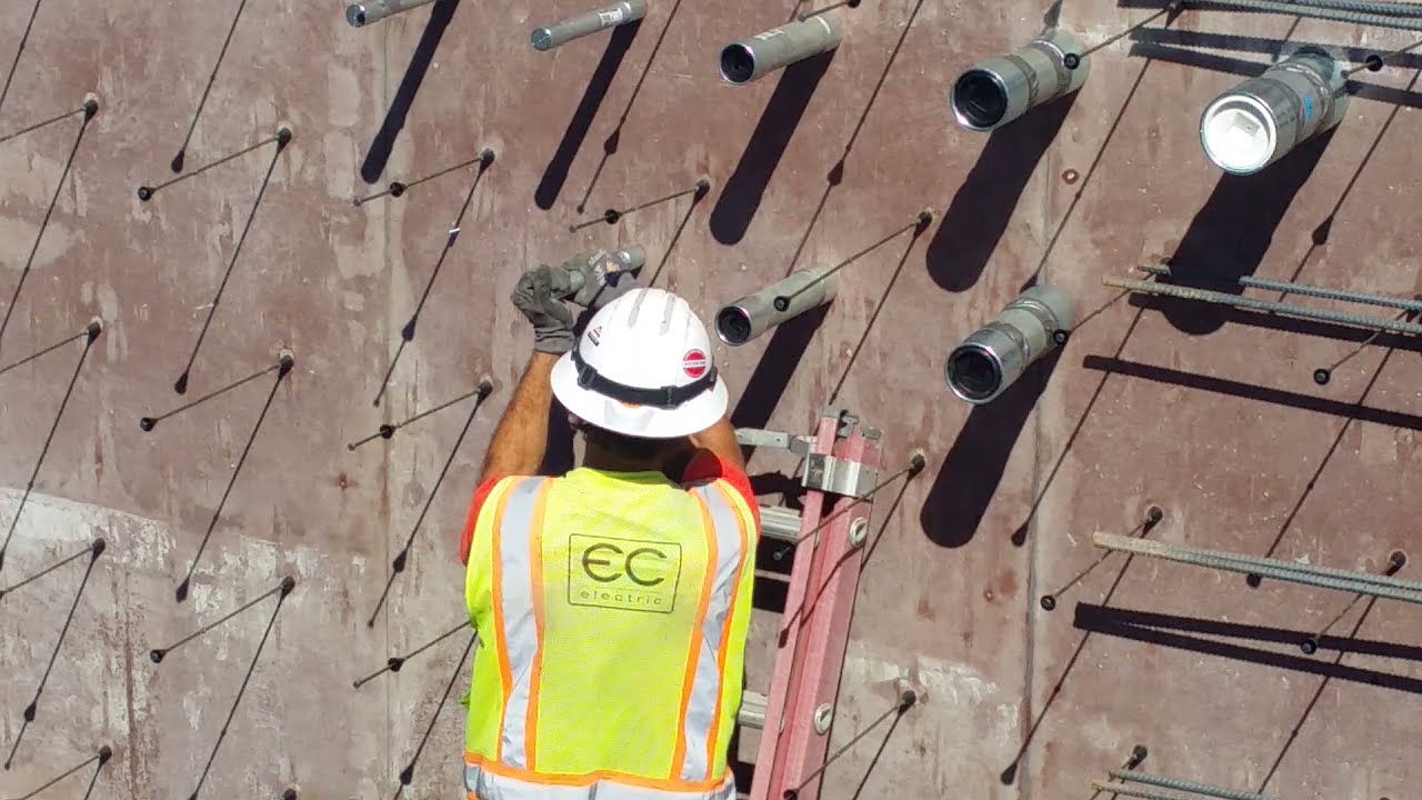 Installing conduits into concrete forms in a 12 inch thick basement