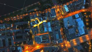 AERIAL: Birds View of Big City Construction Site at Night,City Lights, Traffic,Movement
