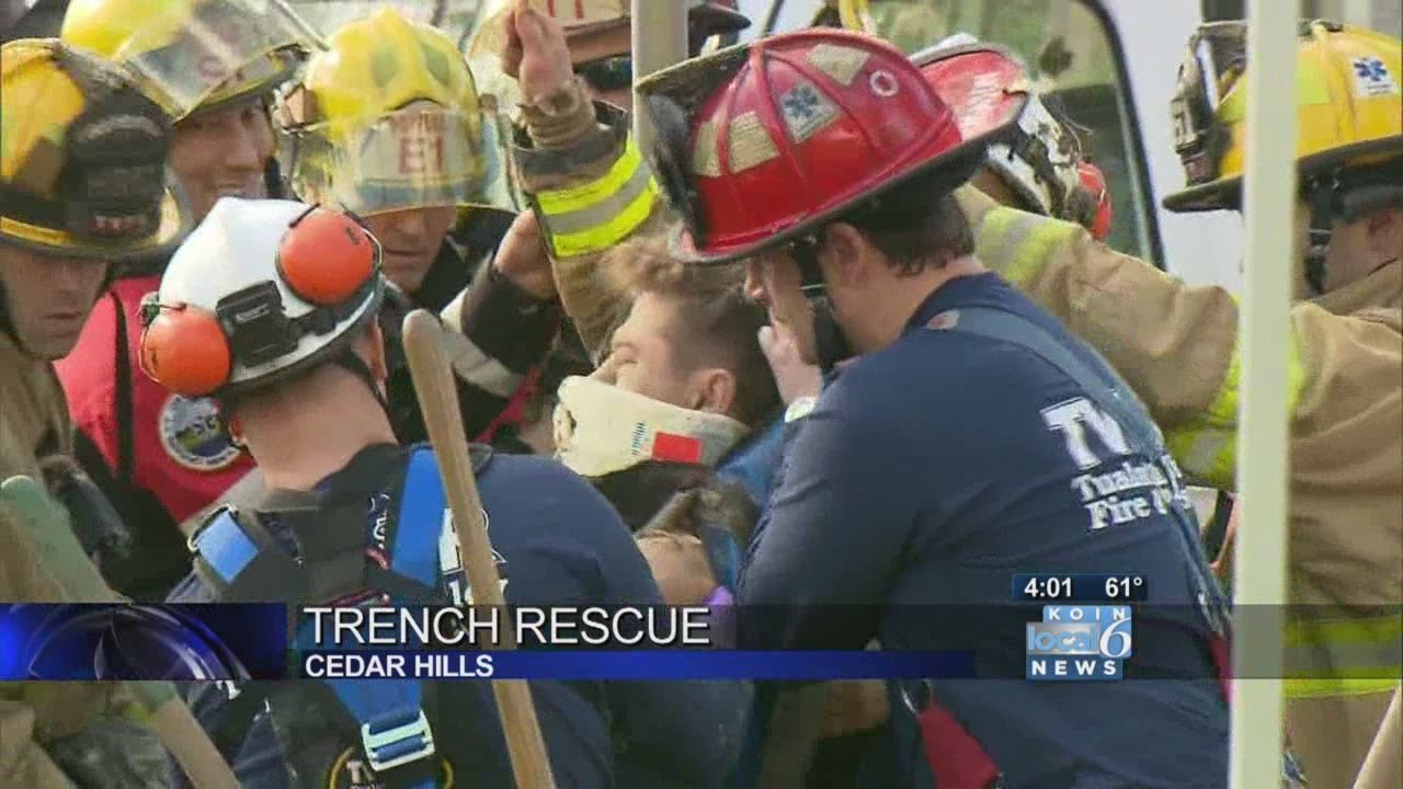 Trapped worker rescued from collapsed trench - YouTube