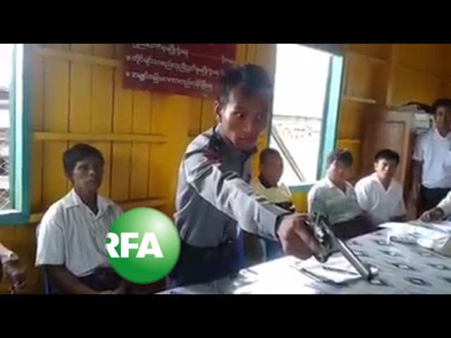 Gun-waving police officer goes viral in Myanmar class=