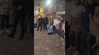 People Joining a Street Singer While Singing Hallelujah