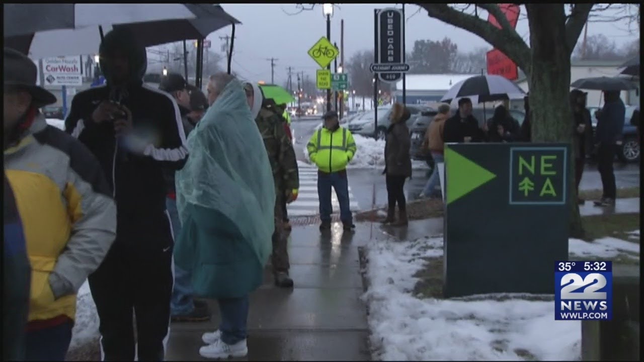 Customers wait in long lines at NETA in Northampton to buy recreational pot